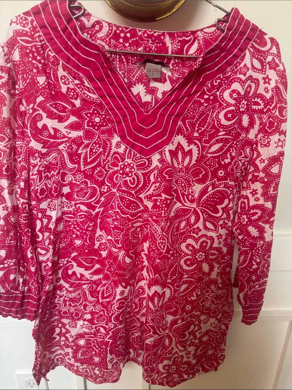 Peppermint Bay pink and white floral tunic top, featuring a split V-neckline